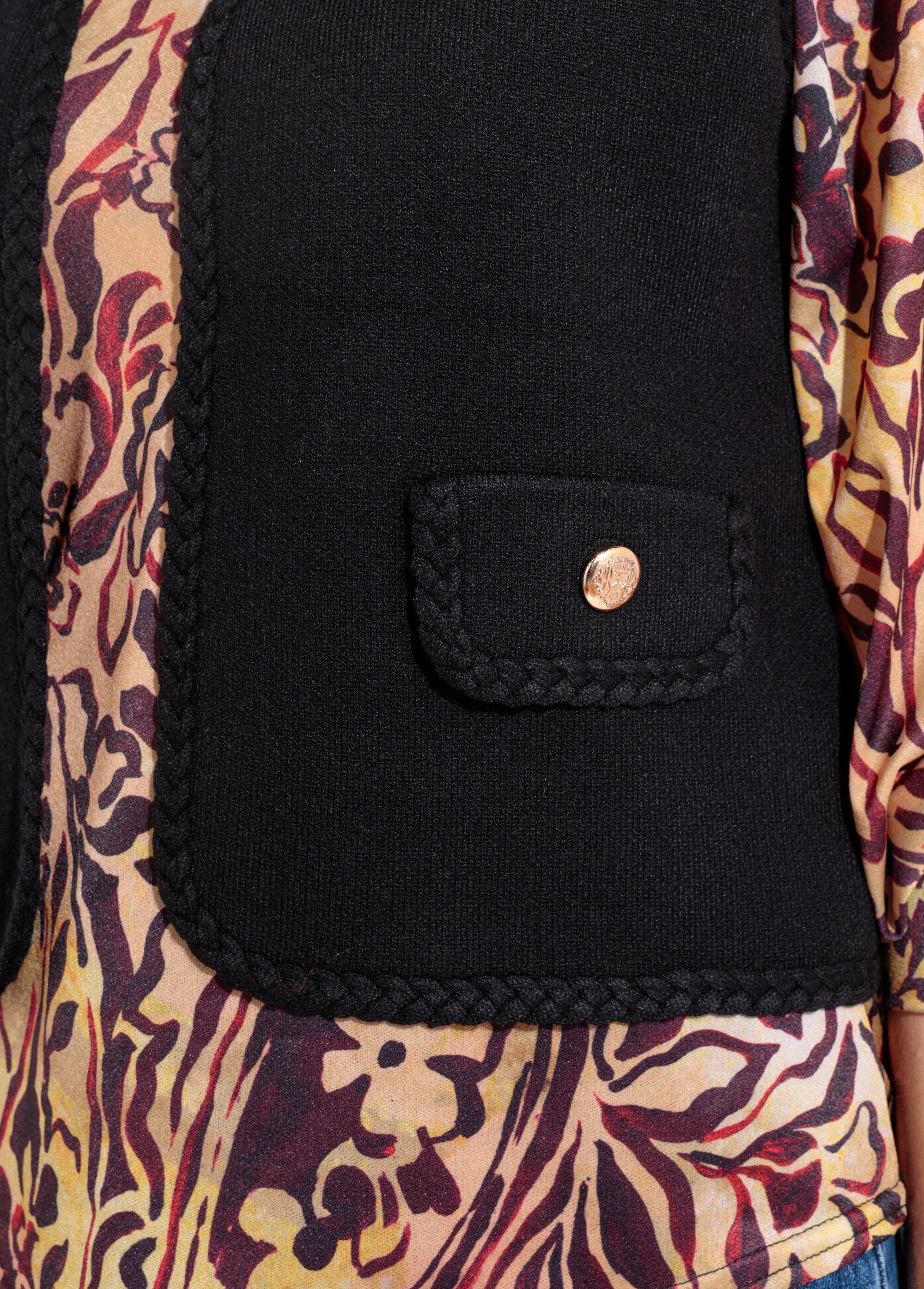 Dik_mouwloos_vest_met_gevlochten_details_Noir_DE1_slim